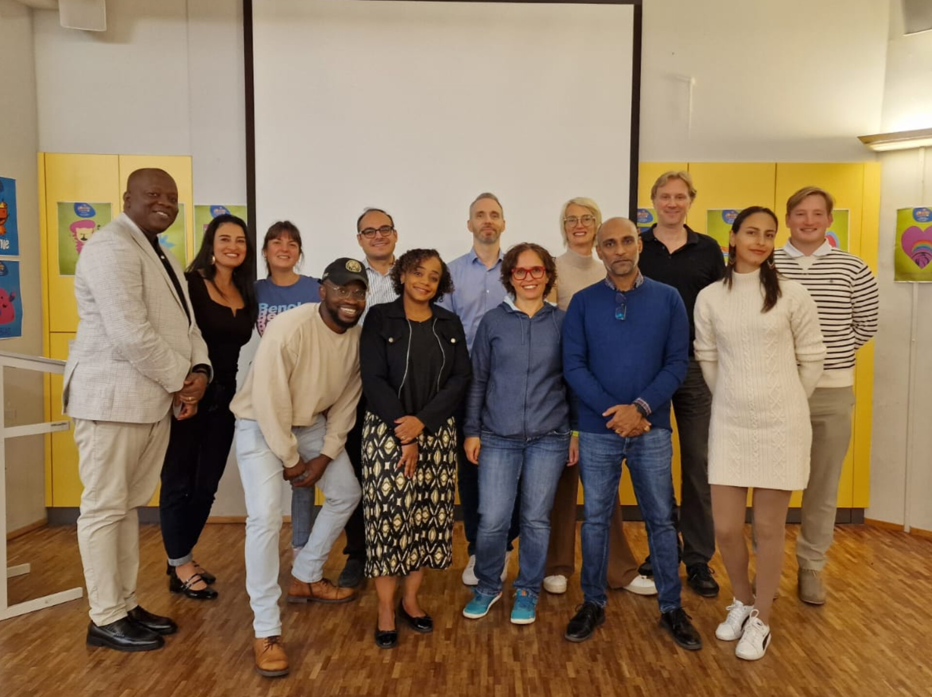 Impact Toastmasters members welcoming guests at a meeting