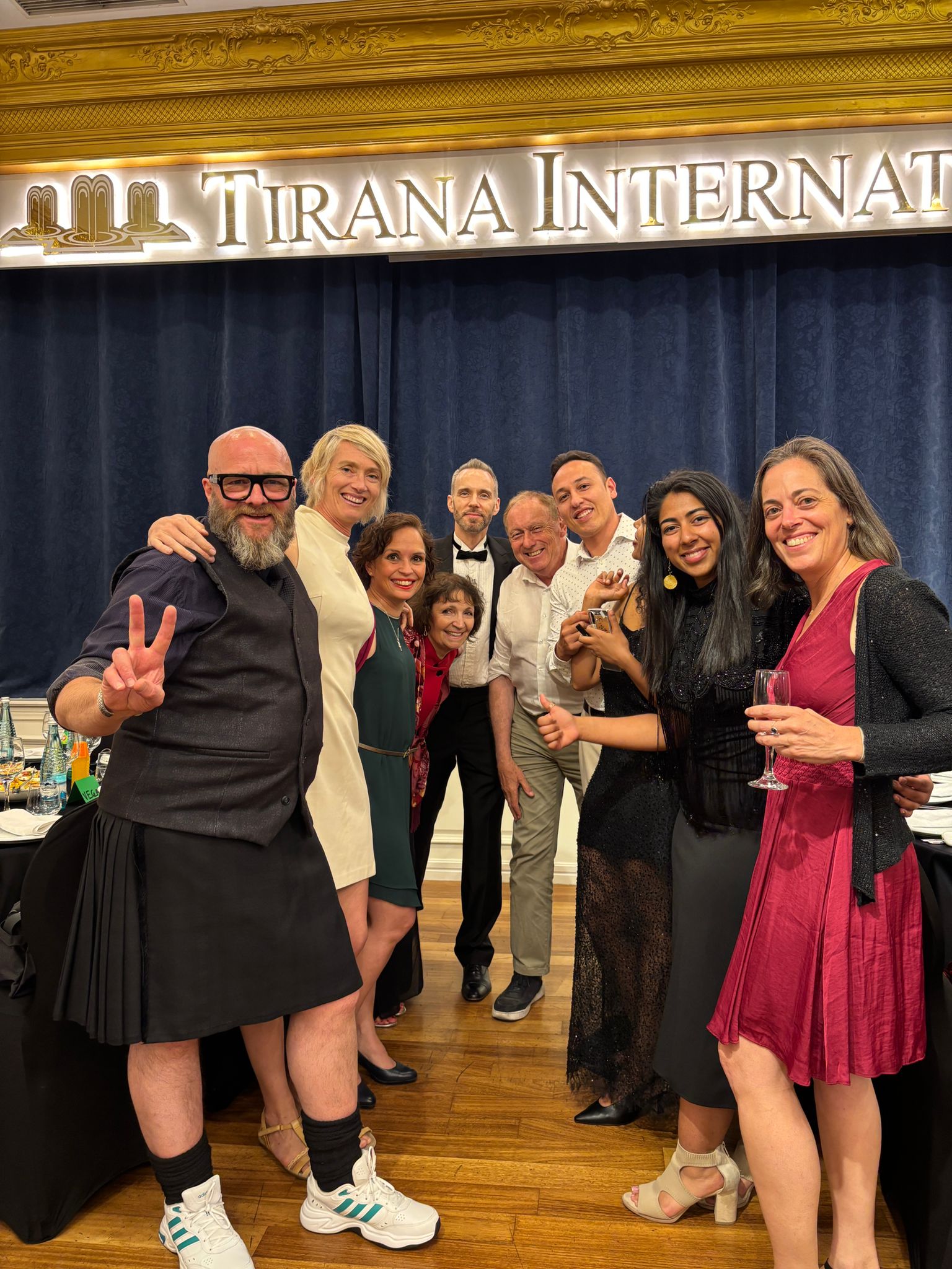 Impact Toastmasters members welcoming guests at a meeting